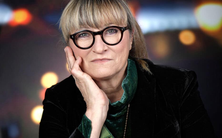 Christine Bravo souriante, évoquant sa carrière