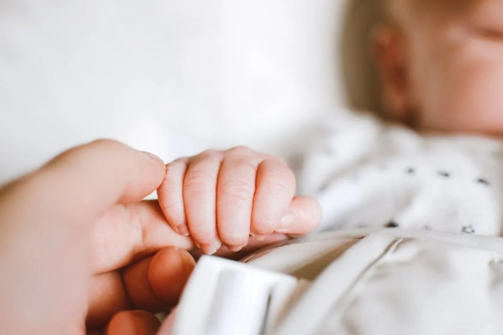 past life: Person Holding Baby