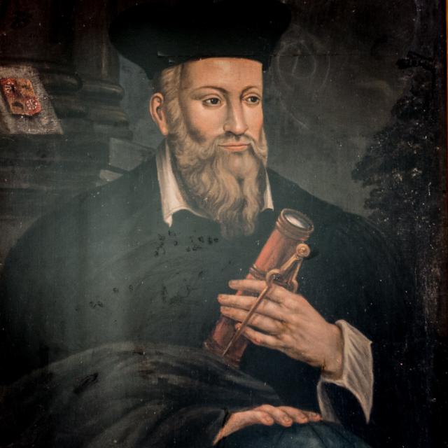 Vieille gravure ou portrait de Nostradamus, avec des symboles astrologiques en arrière-plan